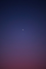 A moon during sunset