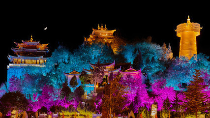 Illuminated Guishan Temple at night, Shangri La, China.