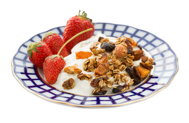Morning breakfast with greek yogurt, granola and whole fresh strawberry isolated on white background. Side view.