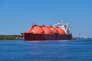LNG or liquified natural gas tanker enter port on a sunny day in Klaipeda, Lithuania. Alternative...