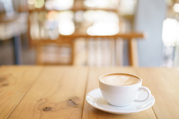 Cup of coffee with fern tree pattern milk foam
