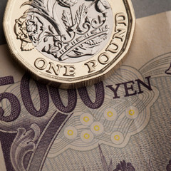British pound coin and Japanese yen trade exchange rate