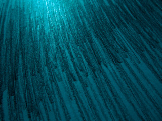 Dark blue green abstract background. Shaded sheet of paper. Pencil strokes. Reflection of light on paper. Black strokes on teal color background. Grunge background.