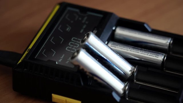 Batteries in the charger. Charge indicator.