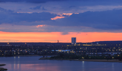 Fototapeta premium Evening lake in an industrial city