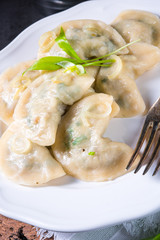 Polish pierogi filled with ramsons pesto