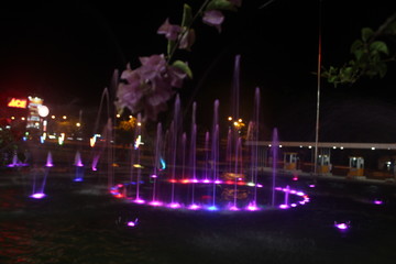 Batam, Indonesia – March 17, 2020: A fountain lights that illuminate a calm and quiet night, Batam Island, Indonesia on March 17, 2020“.