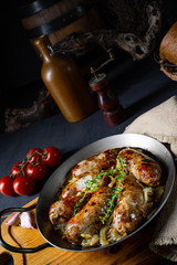 Homemade white sausage fried with onion and herbs