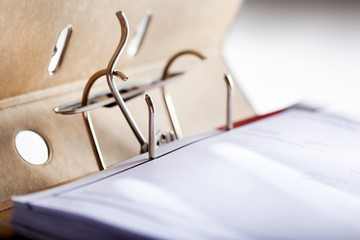 Selective focus on an opened archive ring binder with hardcover