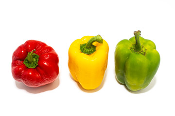 Green, yellow and red peppers On a white background, 
Bell pepper.