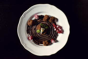 Chocolate truffle sweets with fruit and cheese in a restaurant.