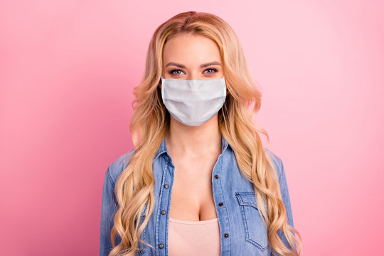 Close-up portrait of her she nice-looking lovely lovable sweet shine content wavy-haired girl stay home quarantine wear fabric mask isolated over pink pastel background