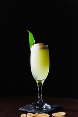 Alcoholic cocktail decorated with banana close-up.