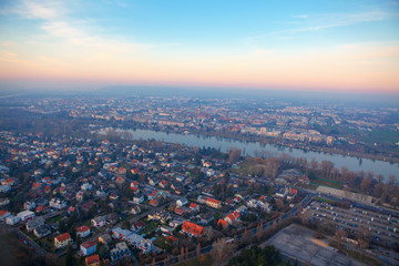 city rooftops of Vienna , aerial view of city and Danube river 