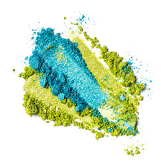 Close-up of make-up swatches. Smears of crushed green and blue eye shadow