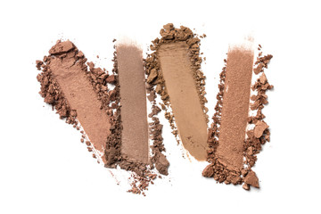 Close-up of make-up swatches. Smears of crushed brown eye shadow