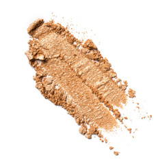 Close-up of make-up swatch. Smear of crushed golden beige eye shadow