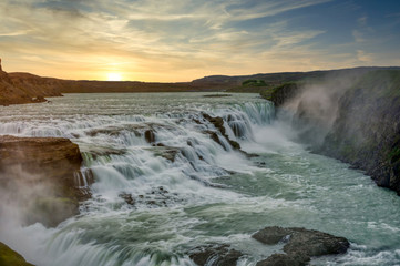 Morning sunrise at Gullfoss Falls Is a popular tourist destination on the Golden Circle route in Iceland. Dramatic dark tones.