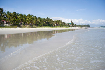 Doc Let Beach in Vietnam. White sand, sea, palm trees on a sunny day