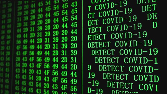 Program HEX COVID-19 DETECTED text code on scientific device screen, green text ASCI information, 4K UHD video
