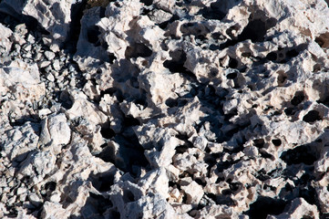 Sharp white rock stones on a sea island
