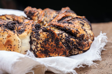Poppy seed cake. Yeast cake with poppy seeds on linen cloth. Country style
