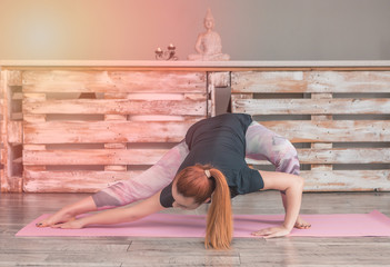 Beautiful young woman practicing yoga 