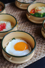 Yummy sunny side up fried egg in classic yellow pinto