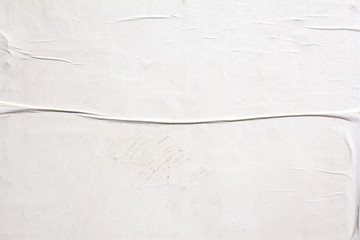 White dirty crumpled paper poster with wavy surface texture background.