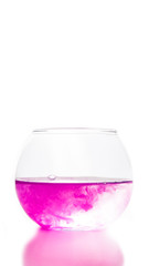 colored water in a glass on a white background. bright colors contrast