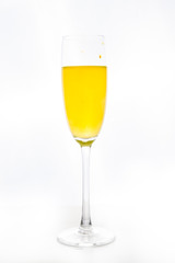 colored water in a glass on a white background. bright colors contrast
