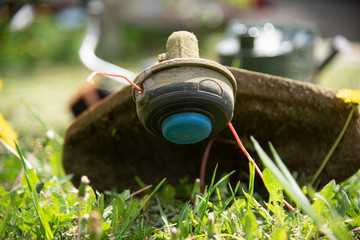 Gas scythe lies on the grass