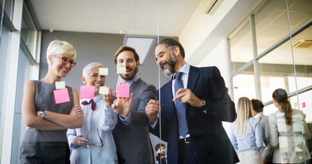 Business coworkers discussing new ideas and brainstorming in a modern office