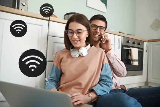 Young couple using wifi at home