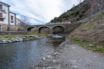 old bridge over the river in spain