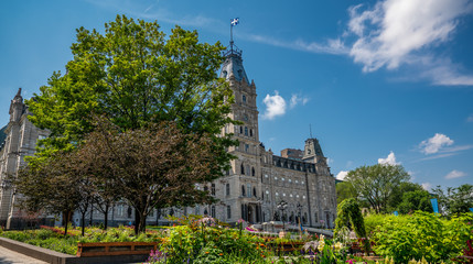 Fototapeta na wymiar Parliament of Quebec with its nice tower. The Jacques Cartier building is a old and huge house where big decisions are made for Quebec province