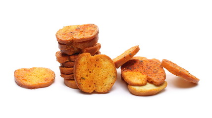 Bruschette chips, grilled bread crisps with tomatoes, olives and oregano, savory snacks isolated on white background