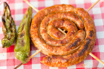 Grilled homemade sausages and green peppers. Barbecue