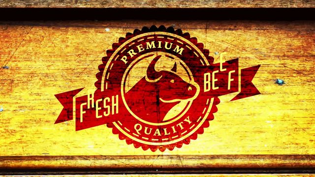 barbecue style premium quality fresh beef butcher shop impression with cow head over wood background