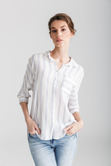 Image of serious caucasian woman posing and looking at camera