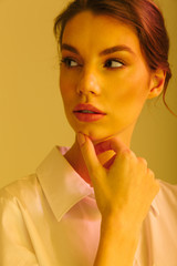 Image of serious successful woman posing and looking aside