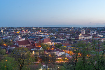 Obraz premium April 27, 2018 Vilnius, Lithuania. View of the old city of Vilnius from Three Cross Mountain at night.