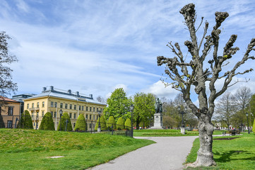Fototapeta na wymiar Carl Johans park with the statue of king Karl Johan XIV during early spring in Norrkoping. Karl Johan was the first king of the Bernadotte family.