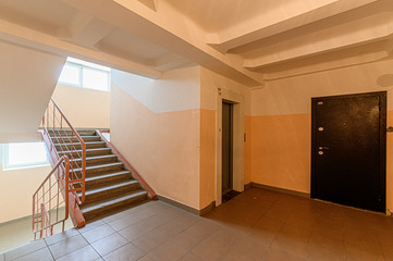 Russia, Moscow- January 25, 2020: interior public place, house entrance. doors, walls, corridors staircase