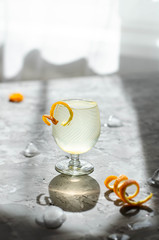 lemonade in a glass on a gray background