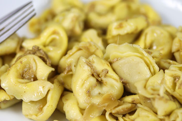 plate of tortellini on a table