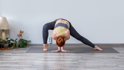 Beautiful young woman practicing yoga 