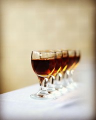 Glasses with cognac on a gray background