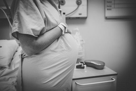 Close up image of a pregnant woman in hospital just before giving birth