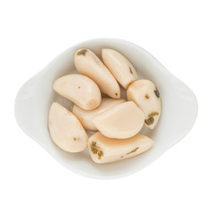 Marinated Garlic - appetizer of vegetables in olive oil. Homemade preserves as a side dish or aperitif